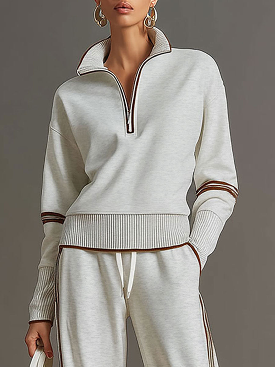 Conjunto de dos piezas gris claro: jersey de punto con cremallera y puños a rayas