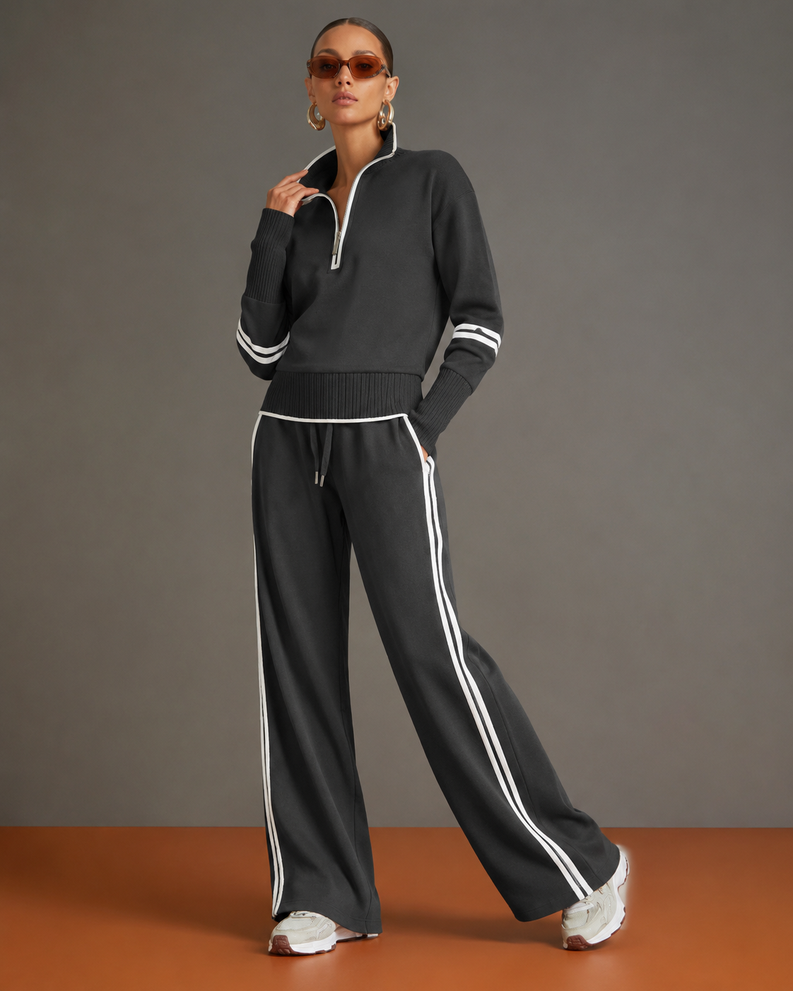 Conjunto de dos piezas negro: jersey de punto con media cremallera y pantalón ancho a rayas