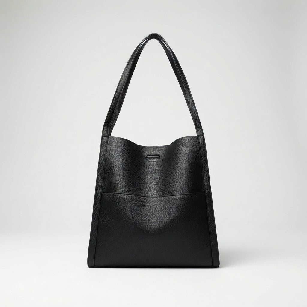 Bolso de mano de piel negro con asas cortas y cierre central rectangular