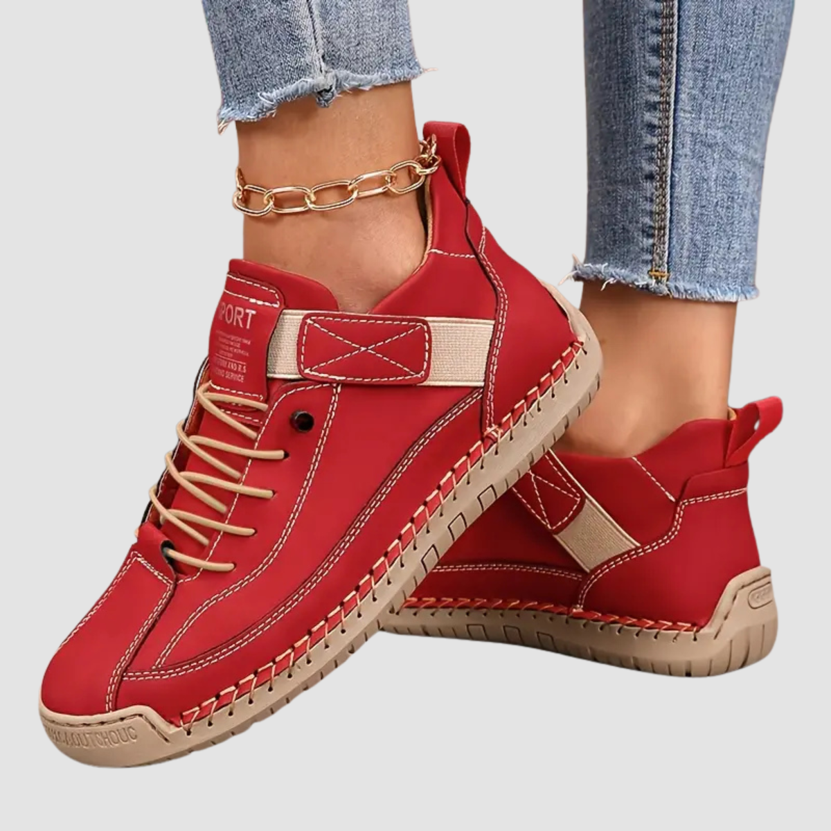 Zapatilla ortopédica roja con cordones y tira al tobillo, suela con costuras