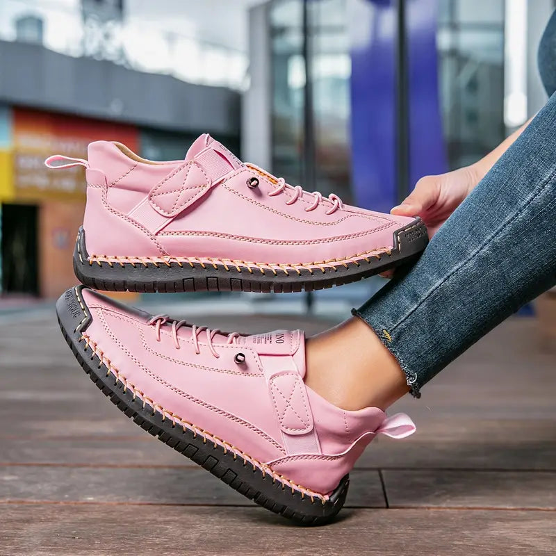 Zapatilla ortopédica rosa claro con cordones y suela dentada negra