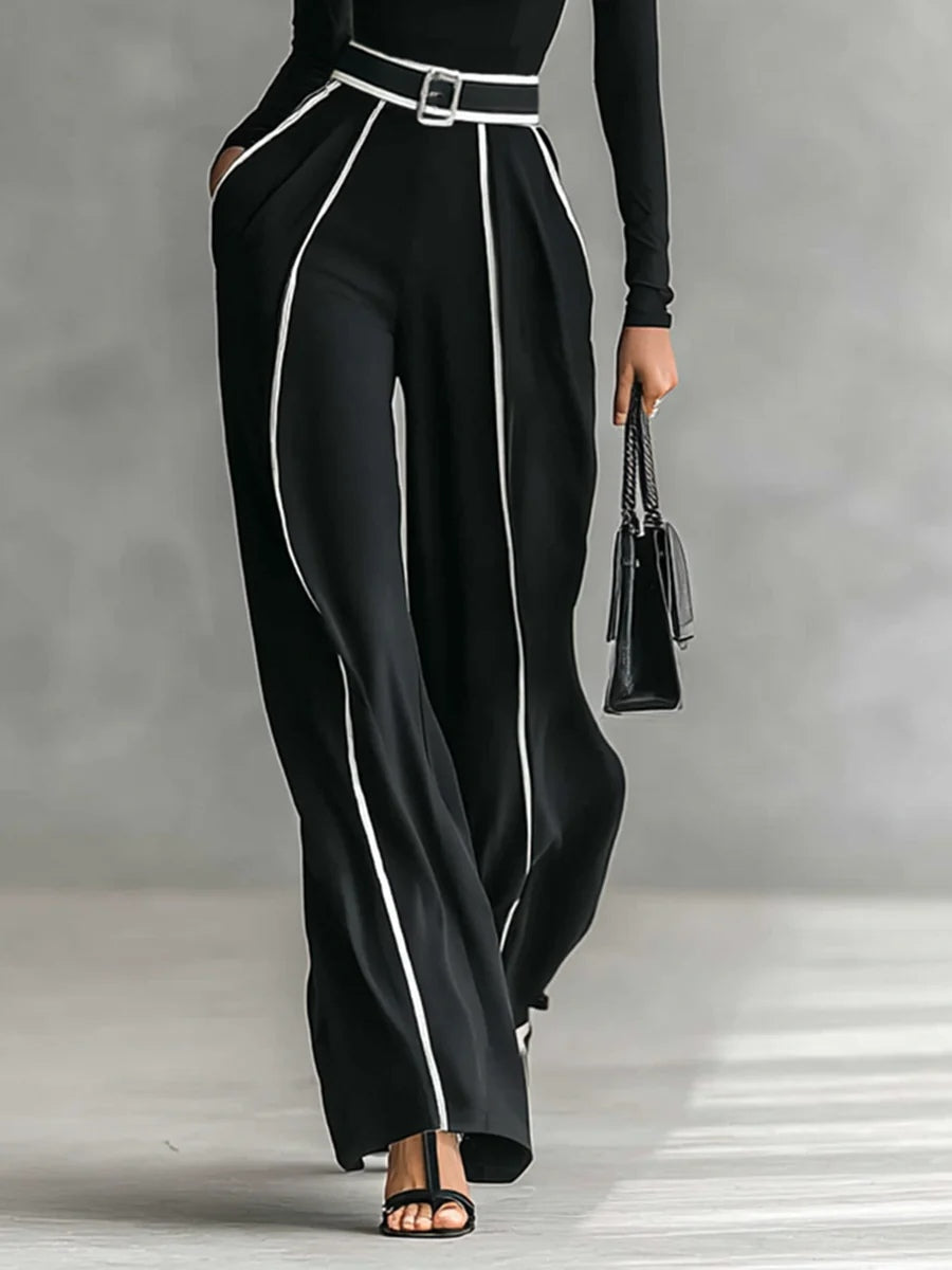 Conjunto negro: cintura con cinturón y pantalón ancho con líneas verticales a contraste
