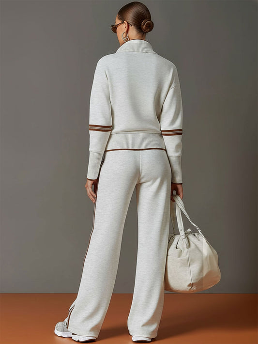Conjunto de dos piezas gris claro visto de espaldas: jersey con cremallera y pantalón ancho