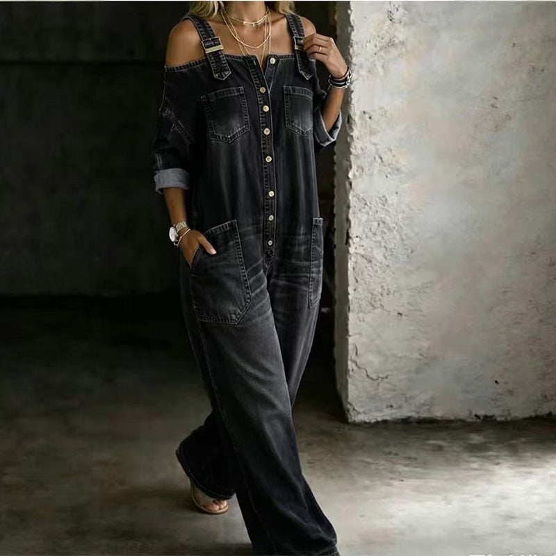 Mono denim negro holgado con tirantes, perneras anchas y bolsillos